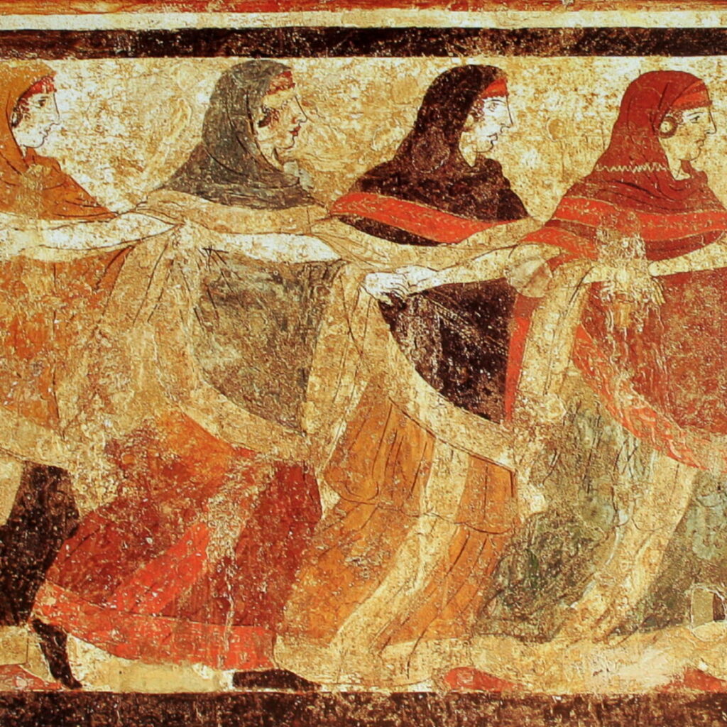 An old Italian fresco of women in long dresses and hair covered. They are holding hands and moving across the fresco as if in a connected dance.
